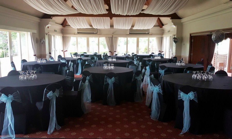 black chair covers and aqua sashes