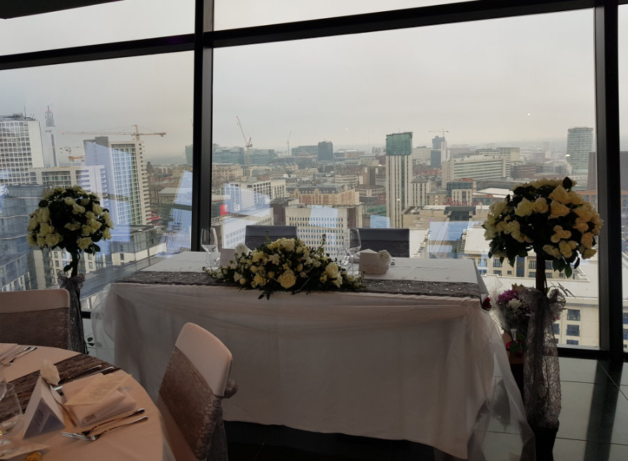 rose trees at wedding top table