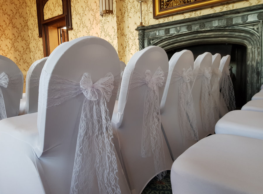 ceremony room at Rowton Castle with white lace chair sashes