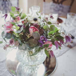 wedding centerpiece with floral arrangement in a bowl vase