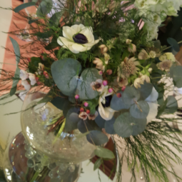 wedding centerpiece with floral arrangement in a bowl vase