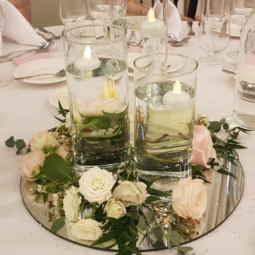 cylinder vase centrepiece with flowes and mirror plate