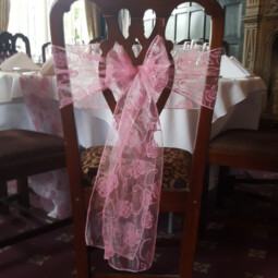 pink patterned chair sash