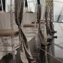 silver drop sashes on ghost chiavari chairs