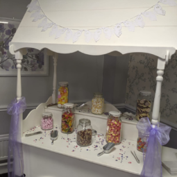 sweet cart with purple and white decor