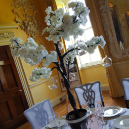 tree centrepiece with white blossom and hanging glass baubles